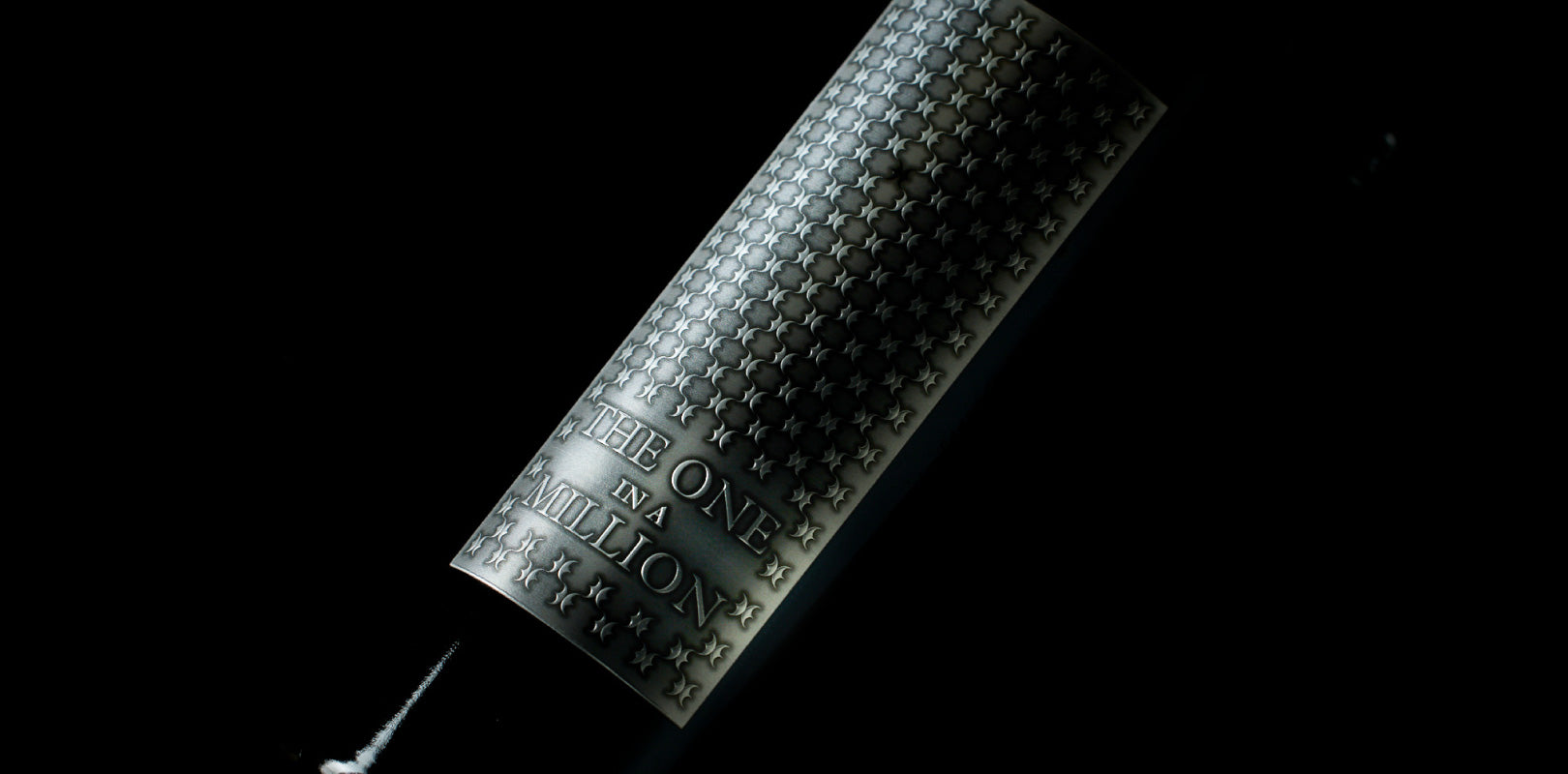 Close up of single bottle of THE ONE IN A MILLION