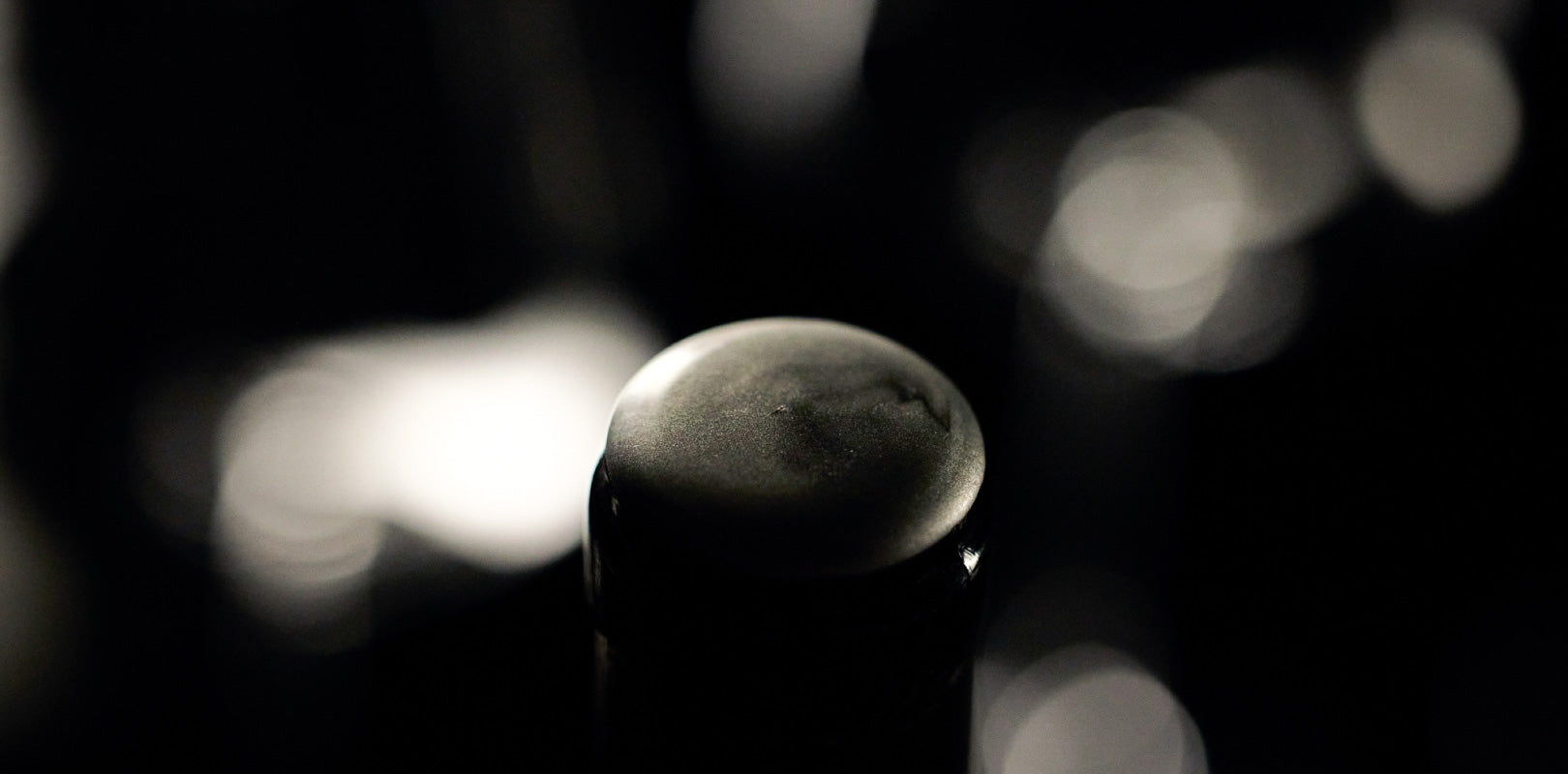 Iconic silver wax seal on top of bottle