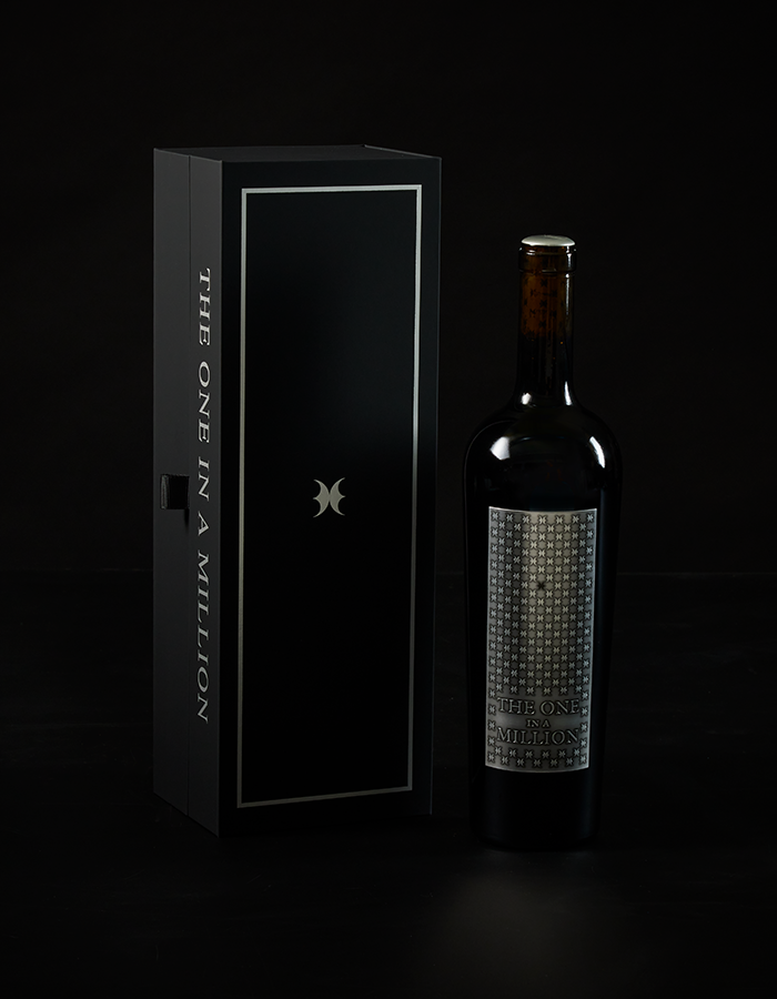 Single bottle of THE ONE IN A MILLION next to presentation box