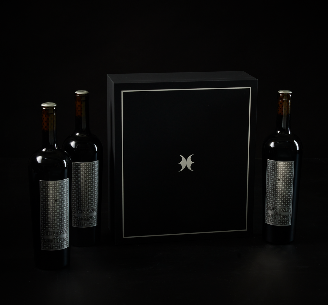 Three bottles of THE ONE IN A MILLION with presentation box