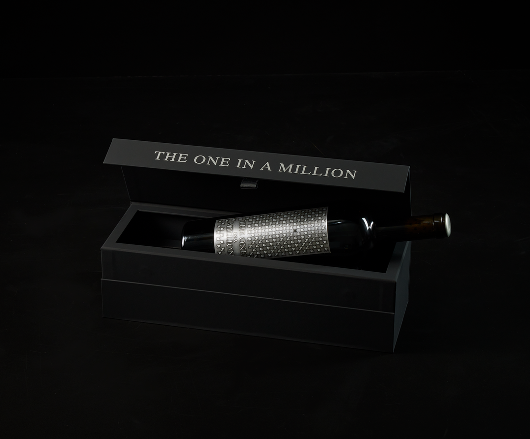 Side view of single bottle of THE ONE IN A MILLION inside presentation box