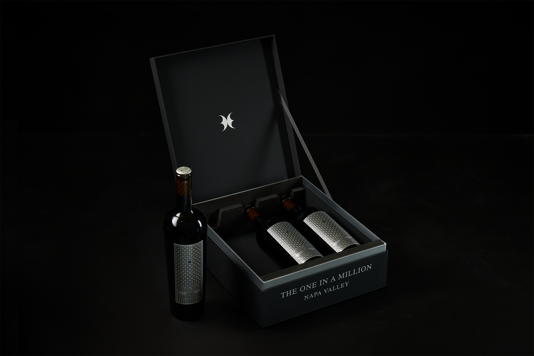 Open presentation box displaying three bottles of THE ONE IN A MILLION